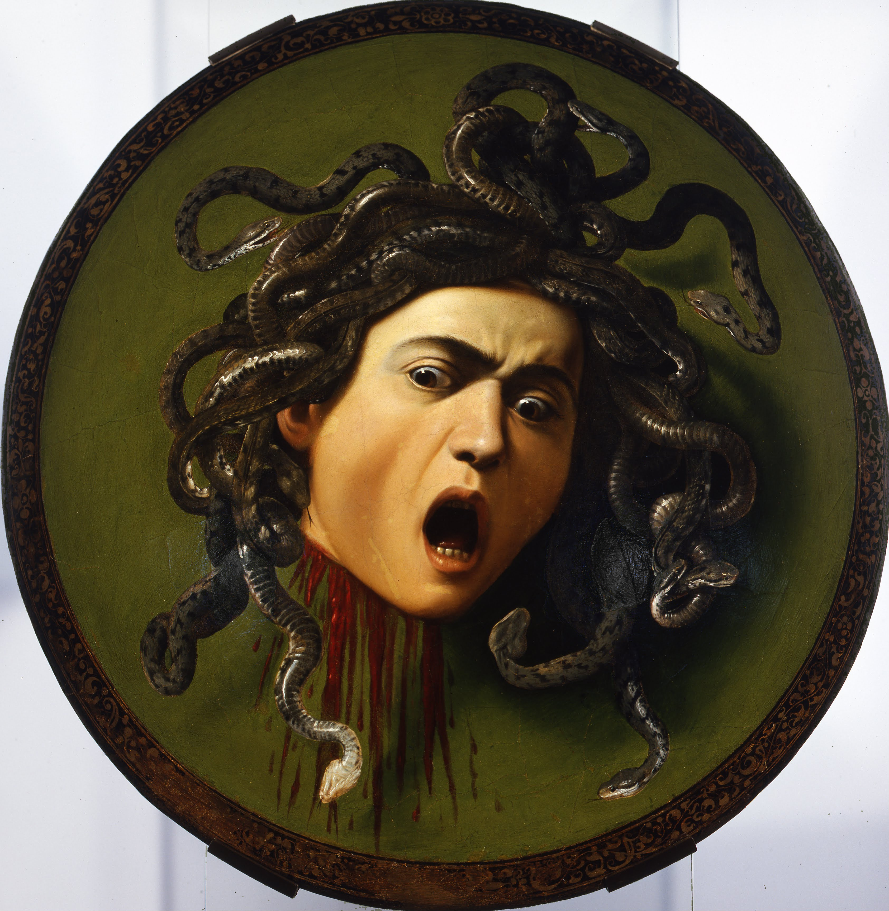 Caravaggio's Medusa, 1597, public domain, the mythological Villain figure whose gaze turns others to stone